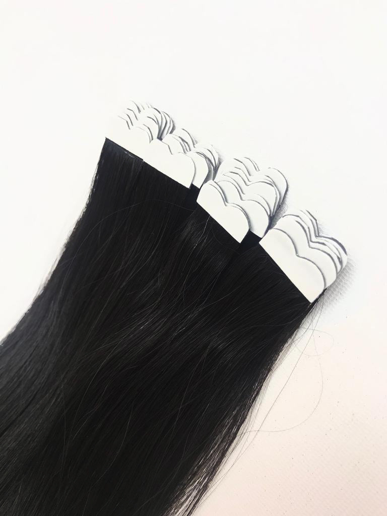 Black color tape in hair extensions